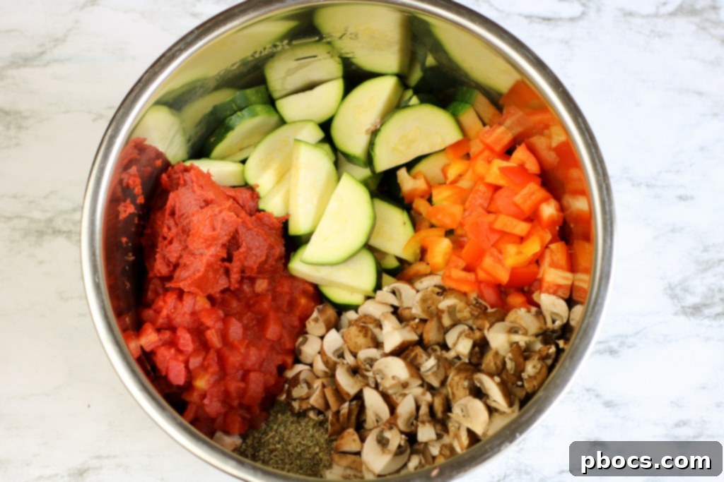 Adding vegetables and broth to Instant Pot pizza soup