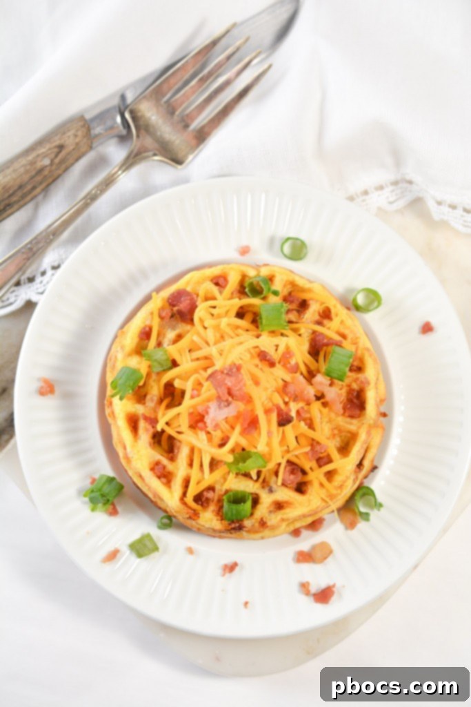 Ultimate Keto Chaffle Breakfast Sandwich 4 Mixing the simple ingredients for Keto Bacon Egg and Cheese Chaffles in a bowl