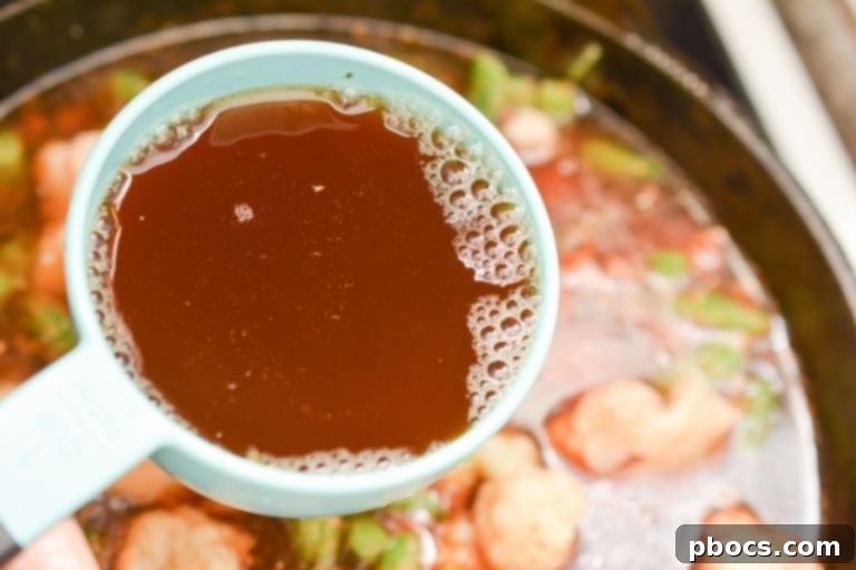 Beef Broth Being Poured into the Pot