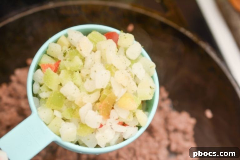 Adding Onions and Celery Mixture to the Soup Pot