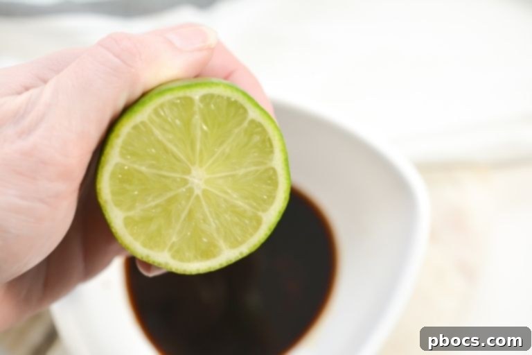 Fresh Lime Juice being squeezed into a bowl