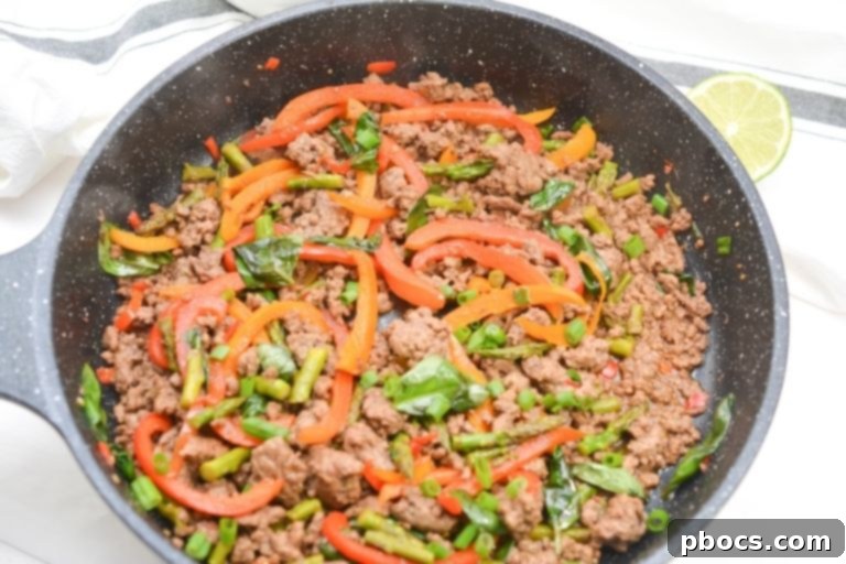 Keto Thai Basil Beef Skillet Meal with Fresh Basil Leaves