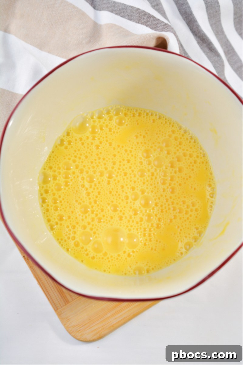 Sizzling Keto Skillet Morning 12 Keto Breakfast Skillet cooking step 4 beating eggs