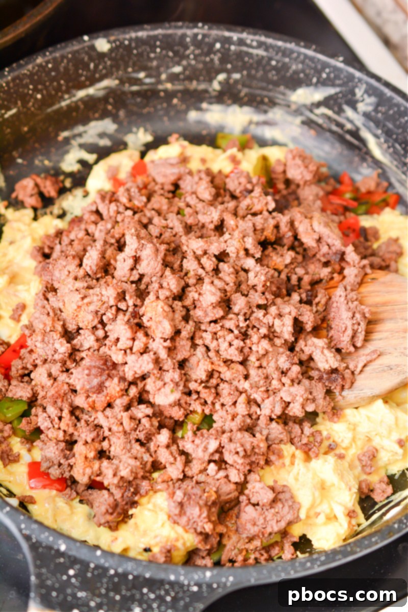 Sizzling Keto Skillet Morning 14 Keto Breakfast Skillet cooking step 6 combining ingredients