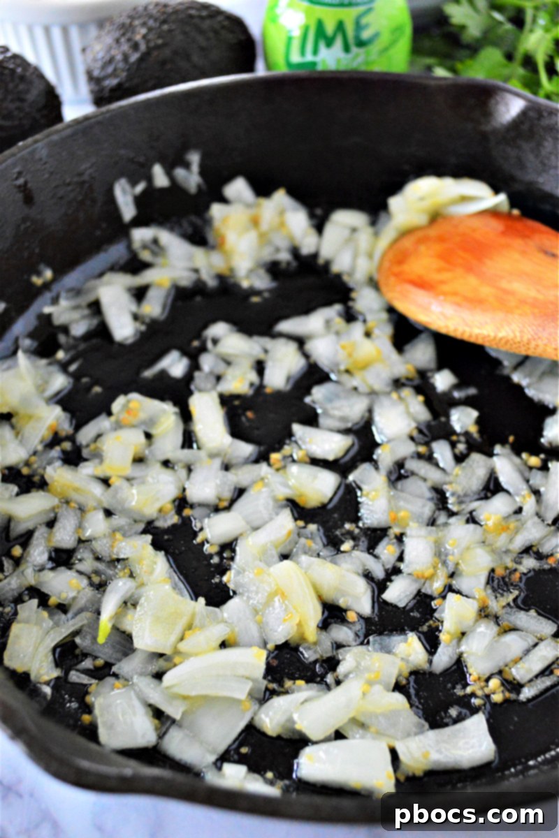 Zesty Cilantro Lime Cauliflower Rice with Creamy Avocado 10 Sauteing onion and garlic for cauliflower rice