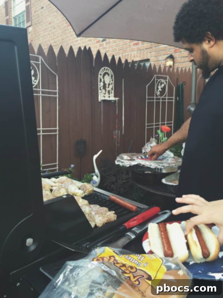 A candid family moment captured during a Fourth of July gathering, showing genuine laughter and connection.