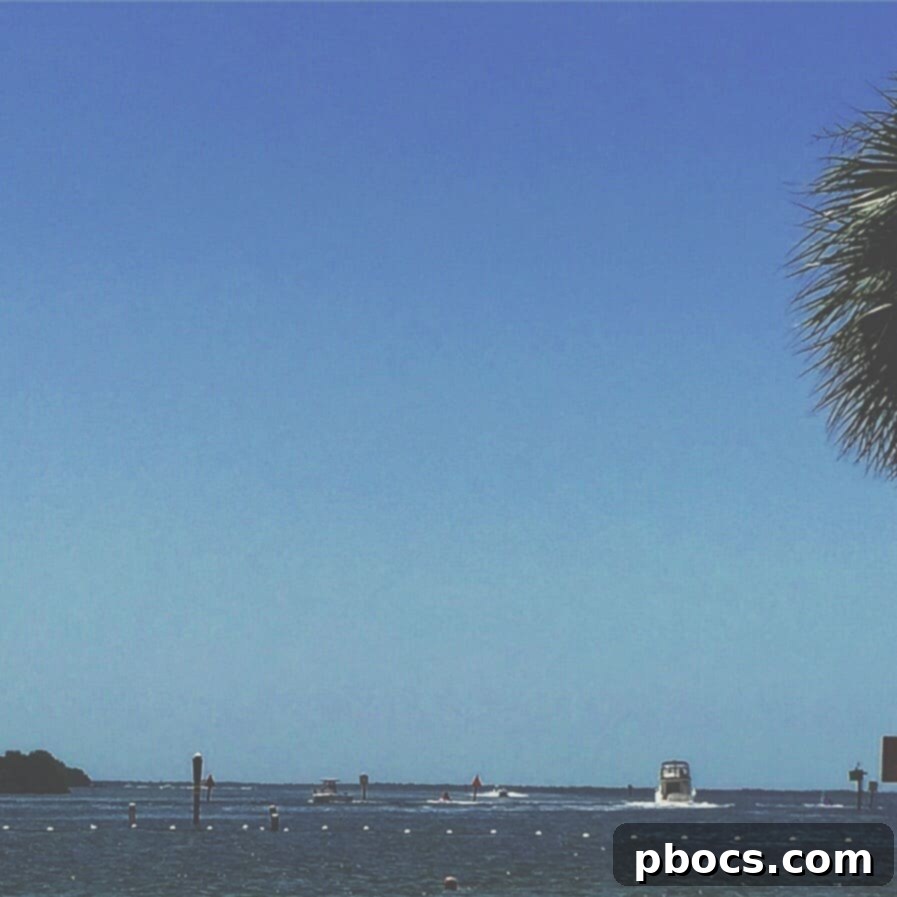 A picturesque view of a serene beach on a cloudy Fourth of July weekend, with subtle hues of blue and grey.
