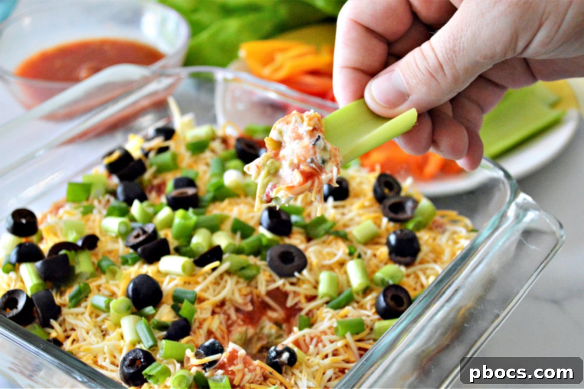 A vibrant Low-Carb 7 Layer Taco Dip, showcasing its layers and fresh ingredients.