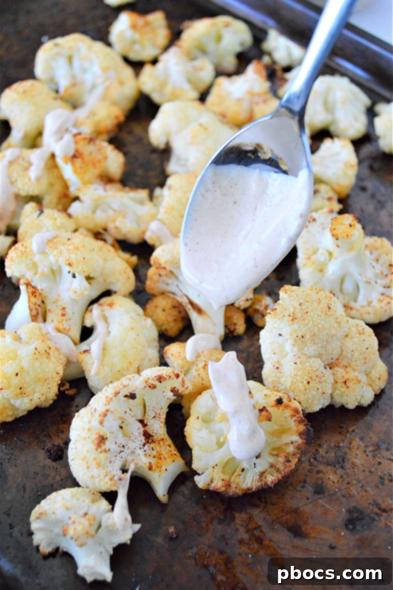 A serving of Keto Mexican Street Cauliflower with lime wedges ready to be enjoyed.