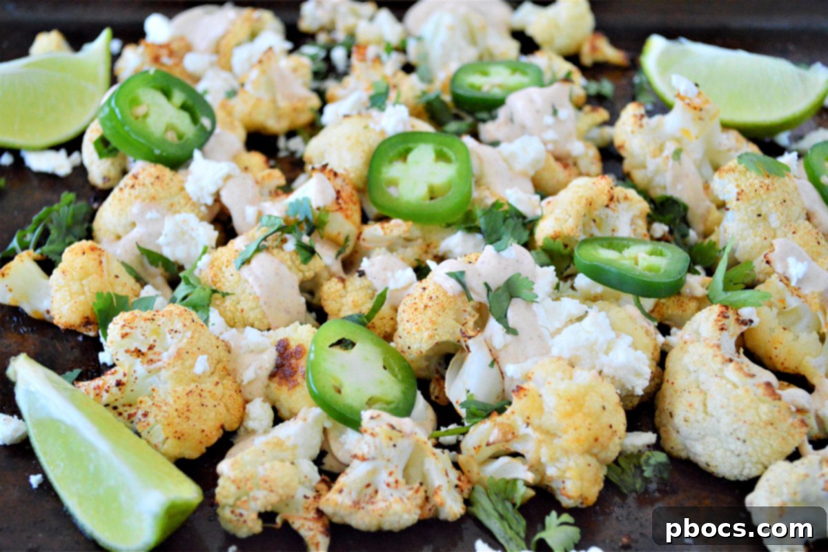Sheet pan filled with perfectly roasted Keto Mexican Street Cauliflower florets.