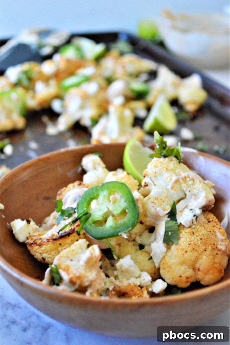 A colorful spread featuring Keto Mexican Street Cauliflower alongside other Mexican-inspired dishes for Cinco de Mayo.