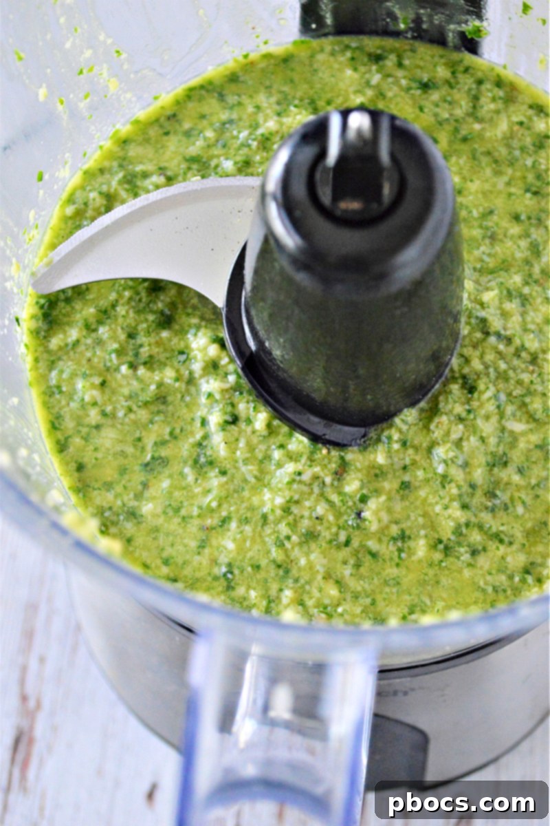 Mediterranean Low Carb Pesto Chicken Salad 11 Blending fresh pesto ingredients in a food processor