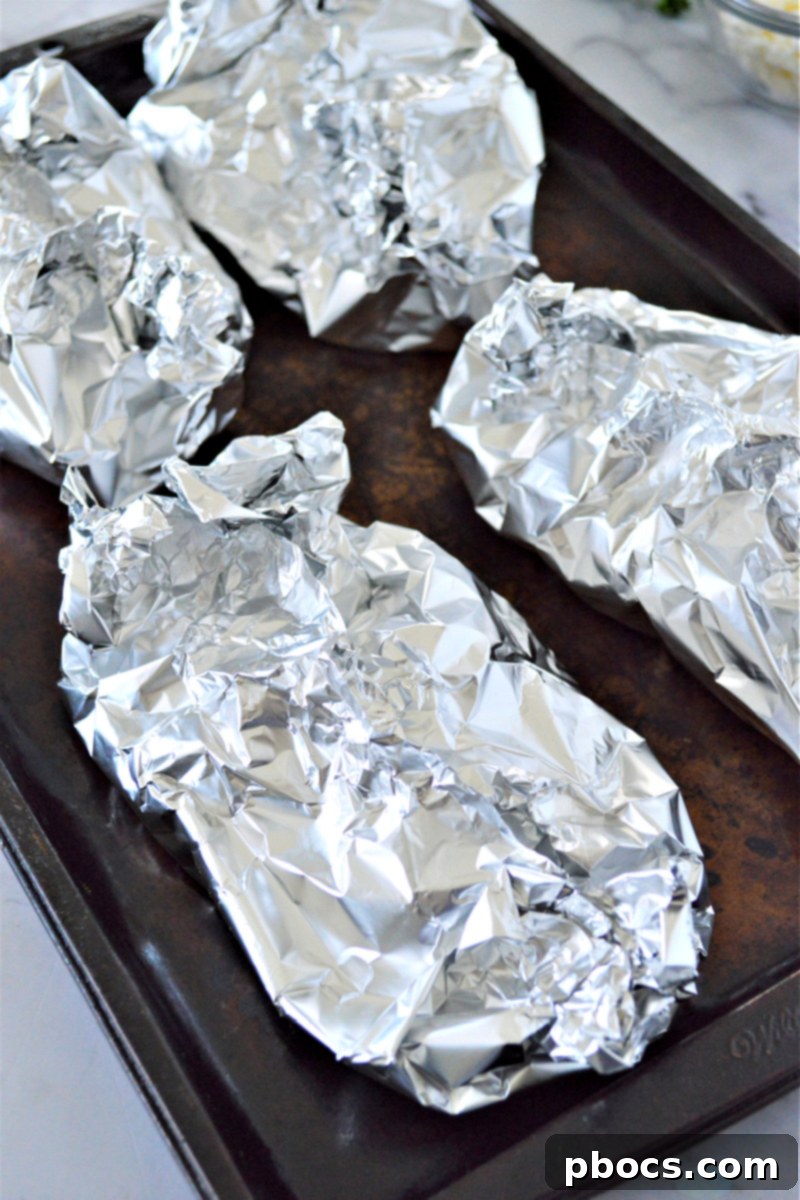 Step 6: Closed foil packets ready for baking or grilling