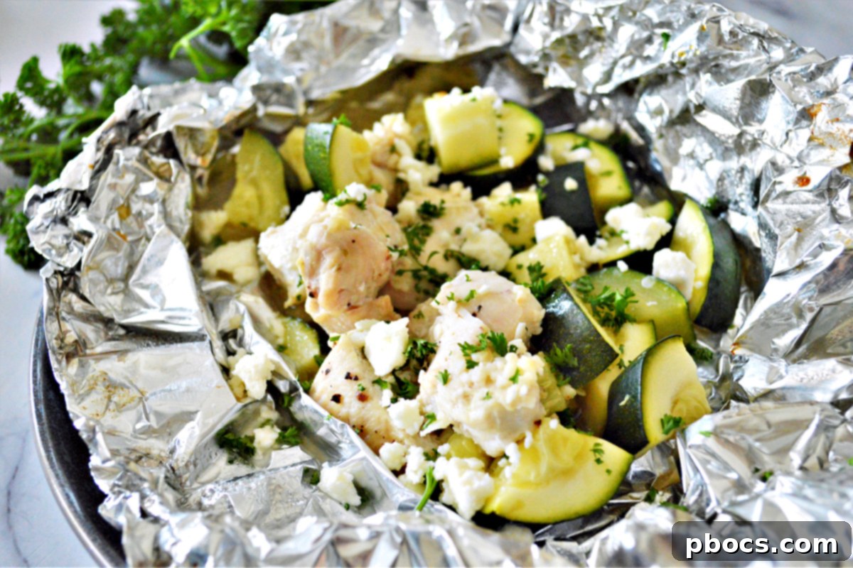Garlic Butter Chicken Foil Packets baking in the oven for a quick dinner