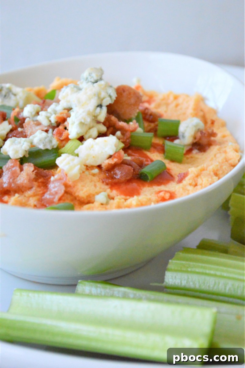 Garnishing Buffalo Cauliflower Hummus