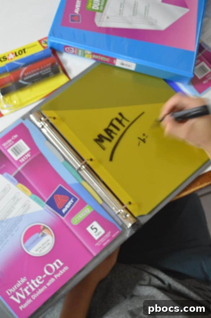 A parent organizing personal documents and planning schedules with Avery glitter binders and dividers
