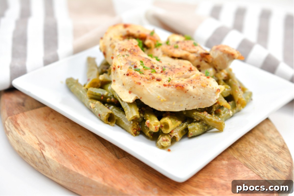 Finished Keto Honey Mustard Chicken and green beans, golden and bubbly after baking uncovered.