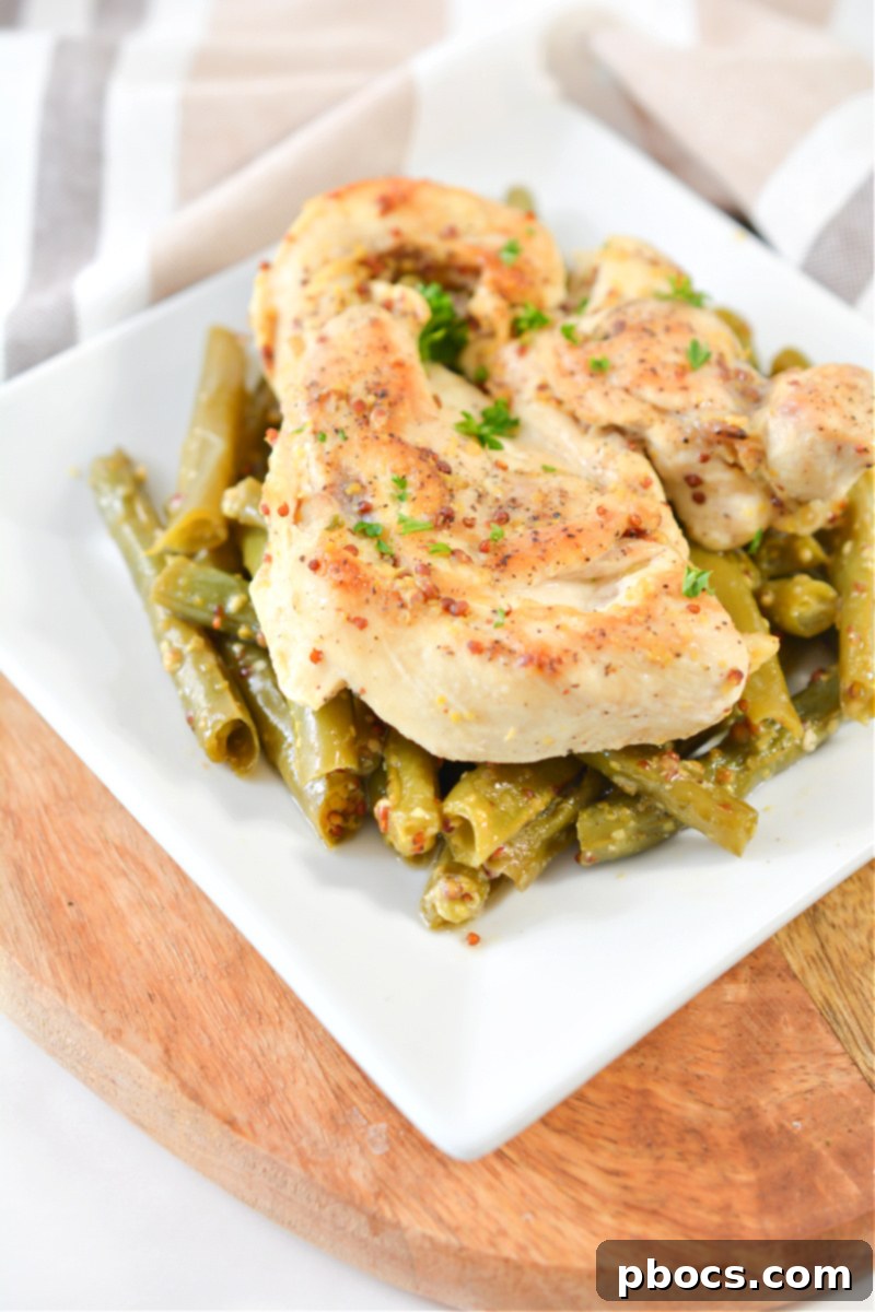 Ingredients for keto honey mustard sauce: sugar-free honey substitute, Dijon mustard, and butter.