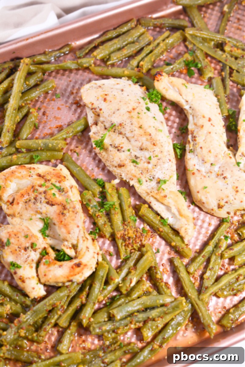 Close-up of a serving of Keto Honey Mustard Chicken, highlighting the tender chicken and sauce.