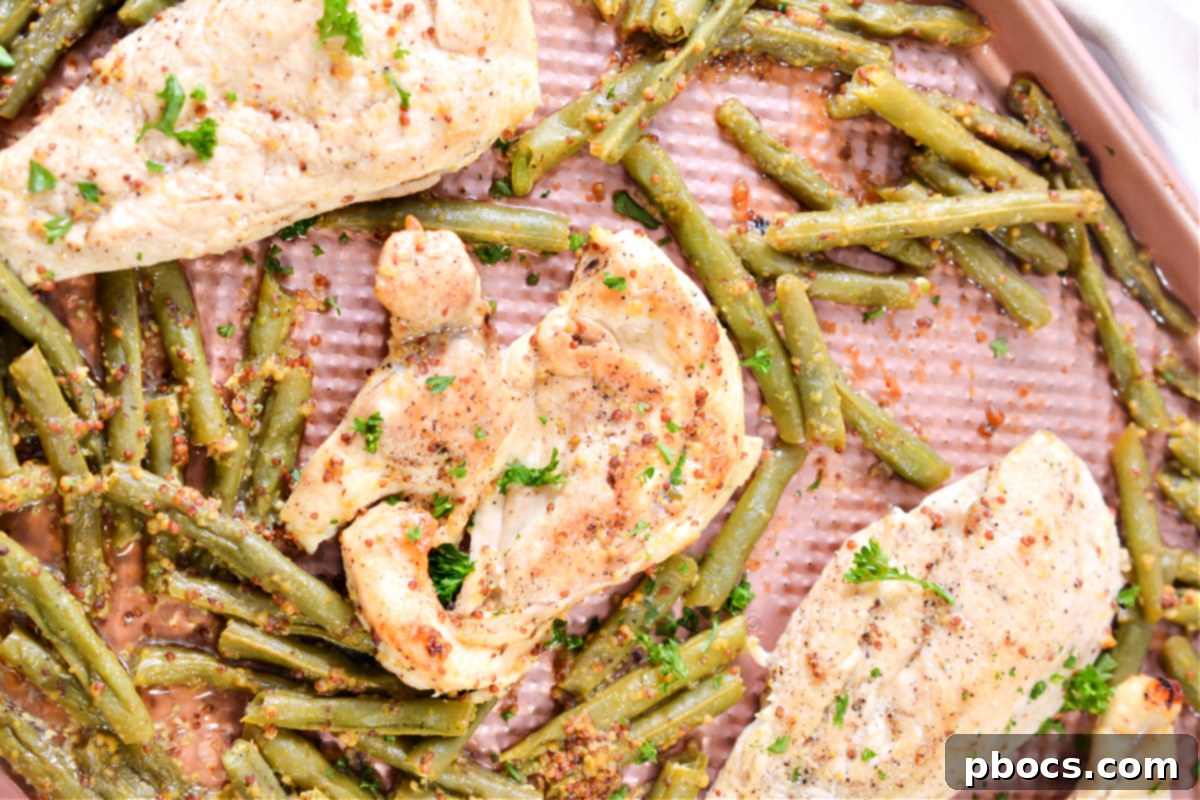 Searing chicken breasts in a hot skillet before adding the honey mustard sauce and baking.