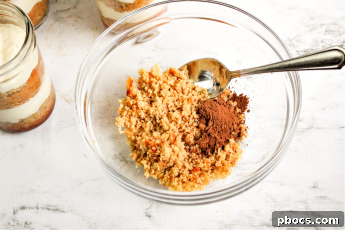 Topping Low Carb Tiramisu in a Jar with cocoa and crumbled cake