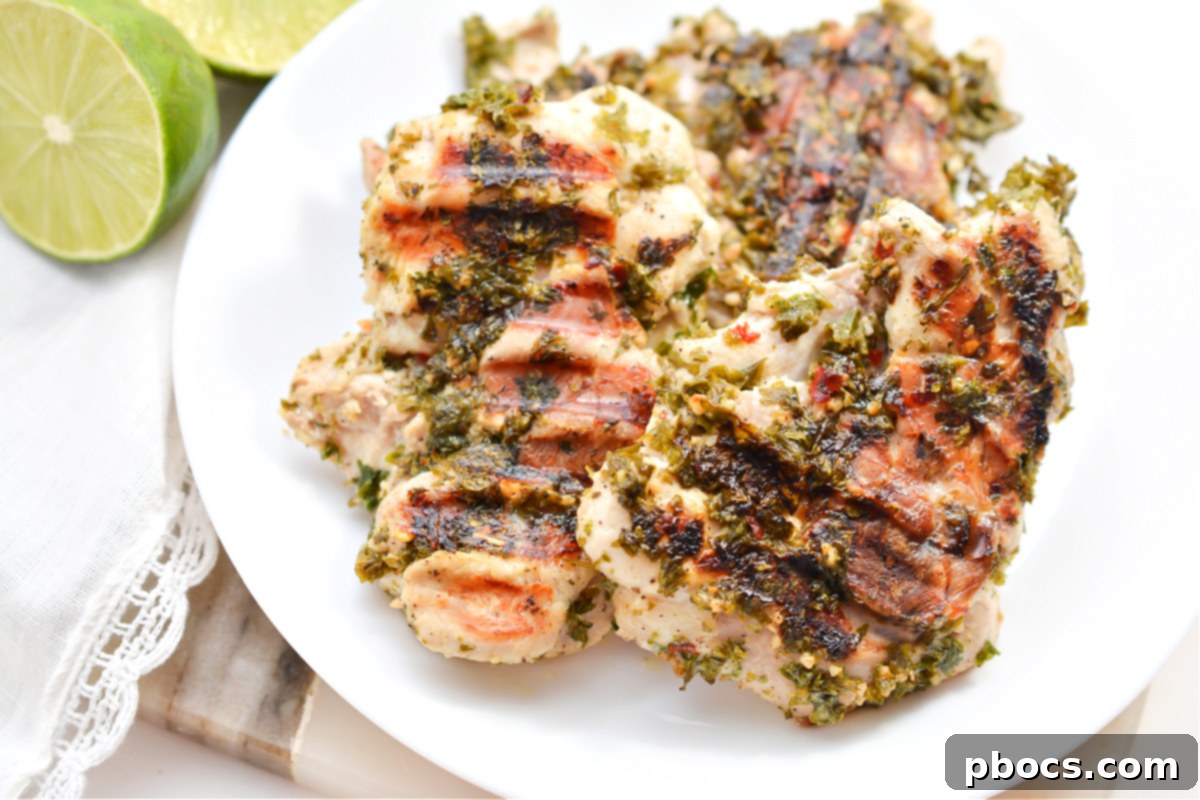 Chef preparing meal prep containers with Keto Chimichurri Chicken