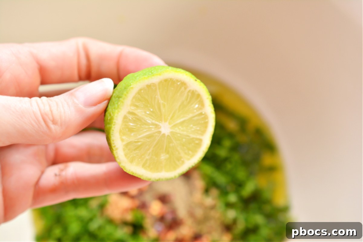 Whisking together the chimichurri sauce ingredients in a bowl