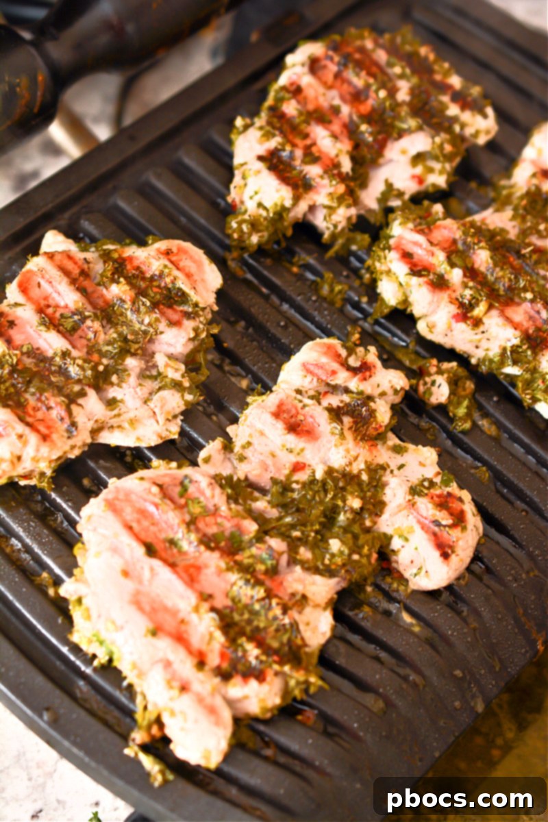 Keto Chimichurri Chicken grilling on a hot grill