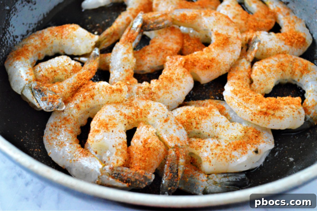 Step 4: Heating olive oil in a skillet for cooking shrimp.