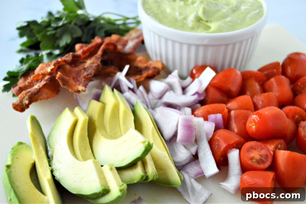 Step 6: Assembling the base of the shrimp avocado spinach salad.