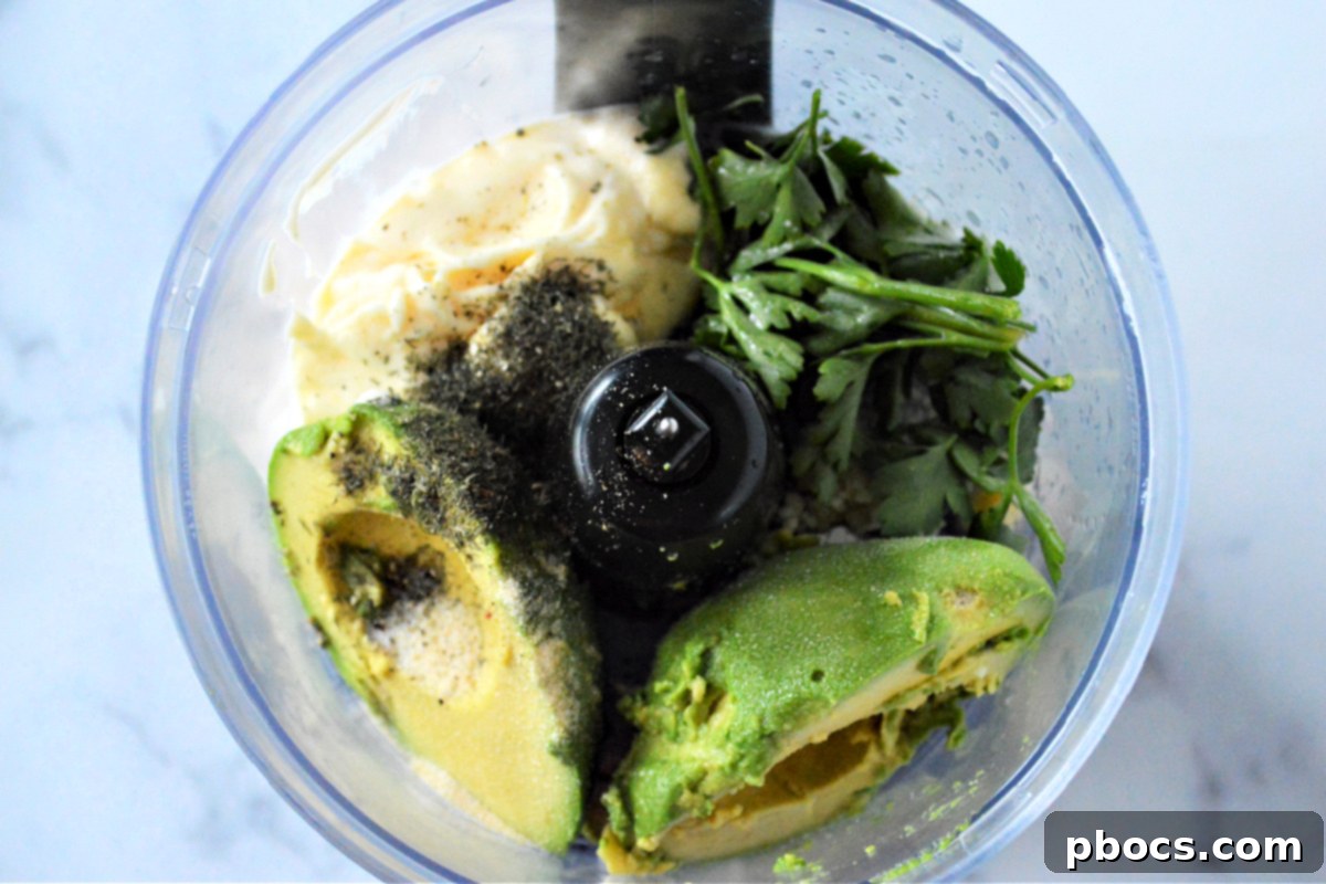 Step 1: Blending ingredients for Keto Avocado Ranch Dressing.