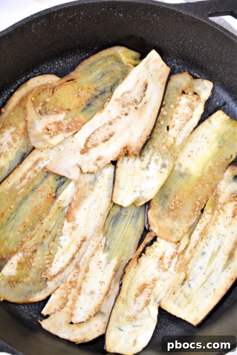 First layer of eggplant in skillet