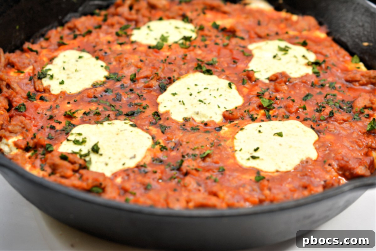 Mixing ricotta cheese and egg for Keto Eggplant Lasagna