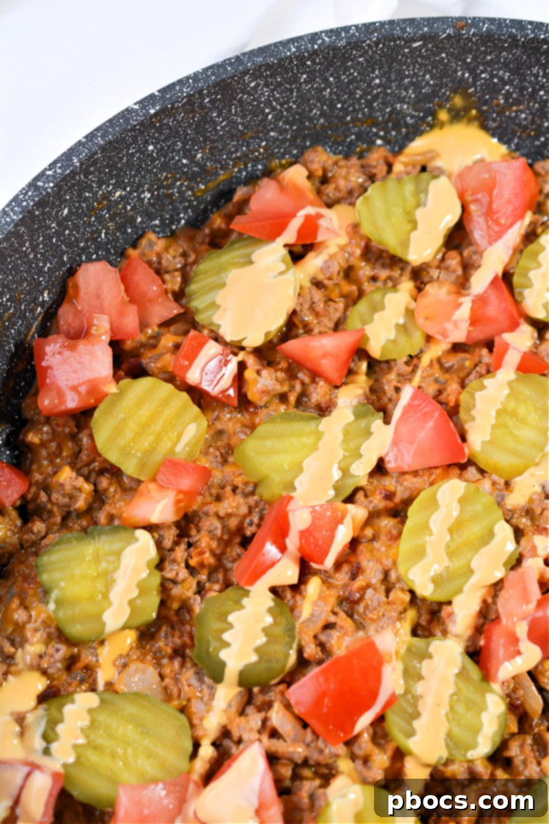 Healthy Keto Cheeseburger Skillet with fresh garnishes