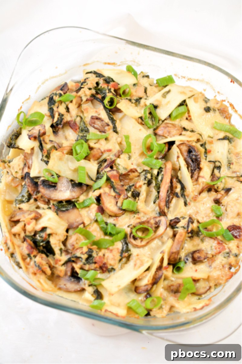 Comforting Keto Tuna Bake 16 A close-up of the Keto Tuna Noodle Casserole with visible mushrooms, spinach, and a rich, creamy sauce.