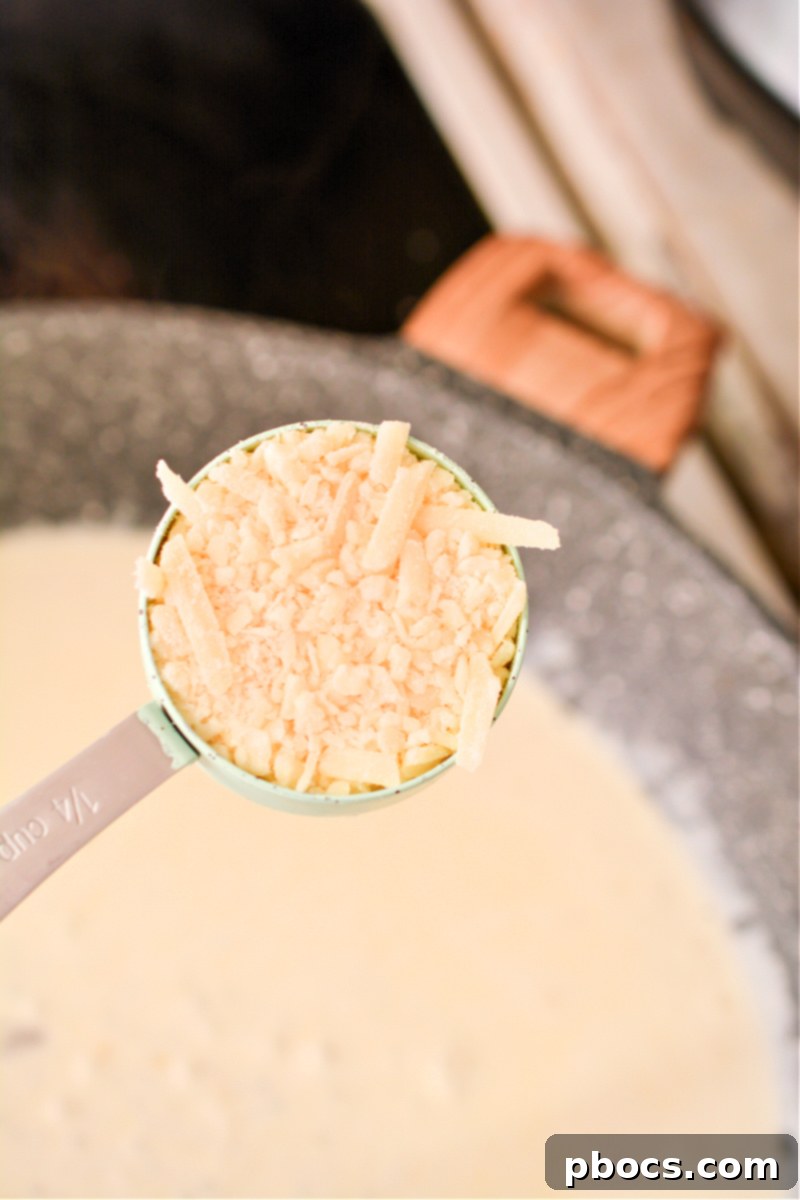 Comforting Keto Tuna Bake 20 Close-up of the creamy sauce thickening in the skillet.