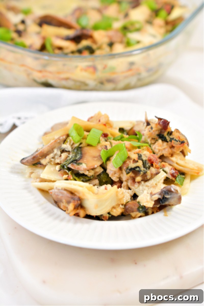 Comforting Keto Tuna Bake 10 A serving of keto tuna noodle casserole, garnished and ready to eat, emphasizing its healthy and hearty nature.
