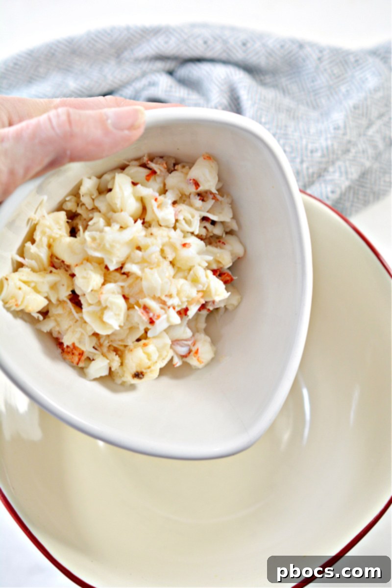 Step 1: Combining lobster, lemon juice, mayo, and seasoning.