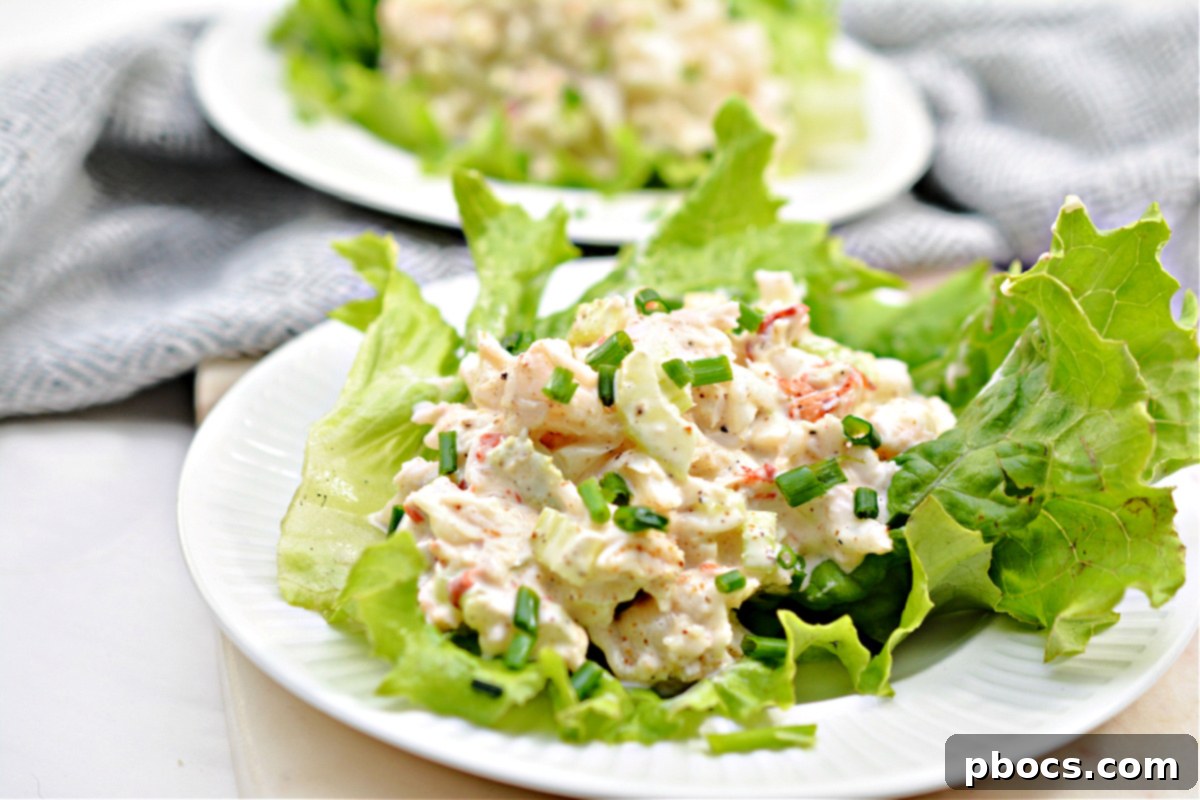 Keto Lobster Salad in a bowl, with keto garlic knots on the side.