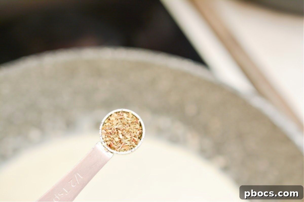 Ultimate Creamy Keto Garlic Shrimp 14 Creamy sauce simmering and thickening in the skillet