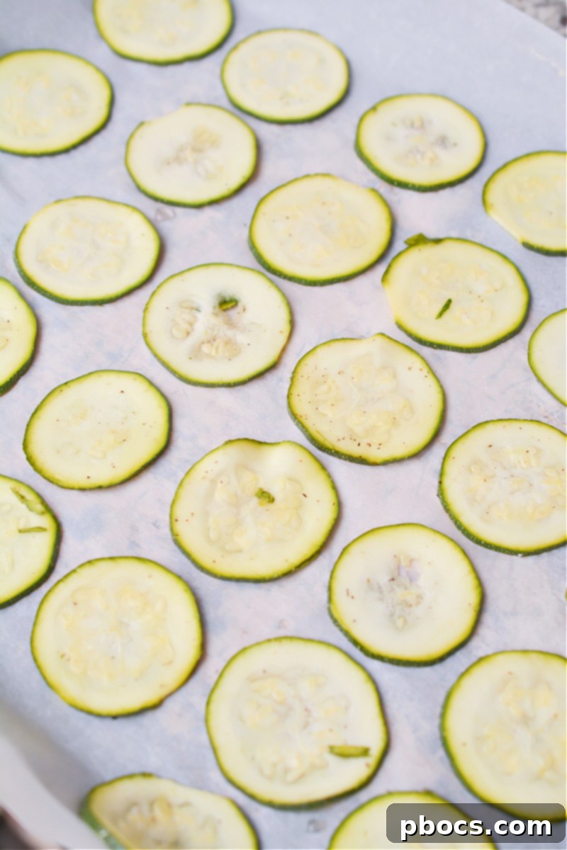 Drained zucchini on baking sheet