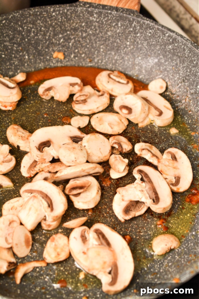 Keto Moo Goo Gai Pan Stir Fry 12 Step 4: Sautéing vegetables for the stir-fry.
