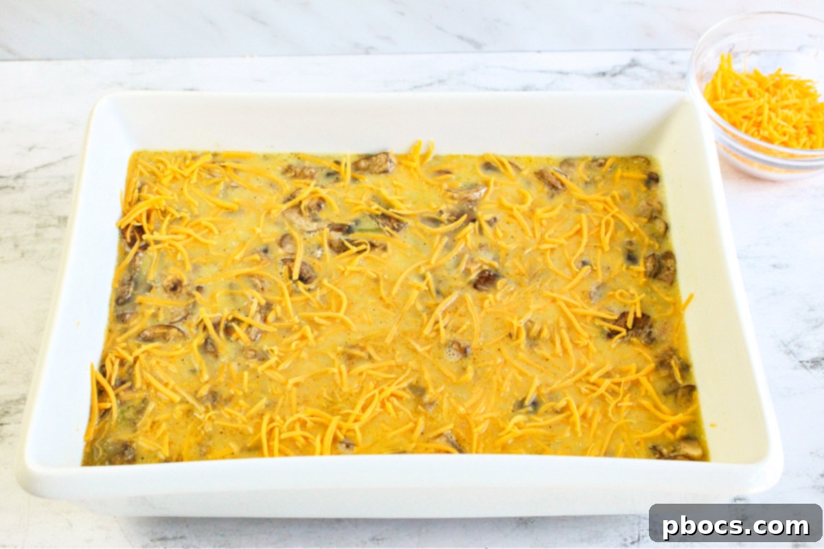 Savory Keto Veggie Morning Bake 14 A bowl of whisked eggs, almond milk, salt, and pepper, ready for the casserole