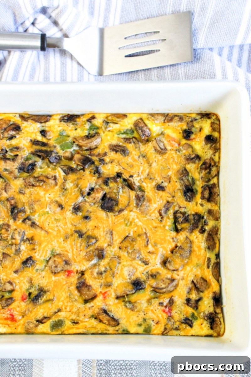 Savory Keto Veggie Morning Bake 5 A close-up shot of the Keto Breakfast Bake, showing the golden-brown melted cheese topping