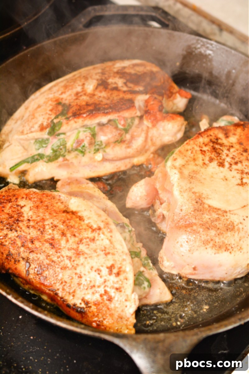 Searing Stuffed Chicken in Skillet