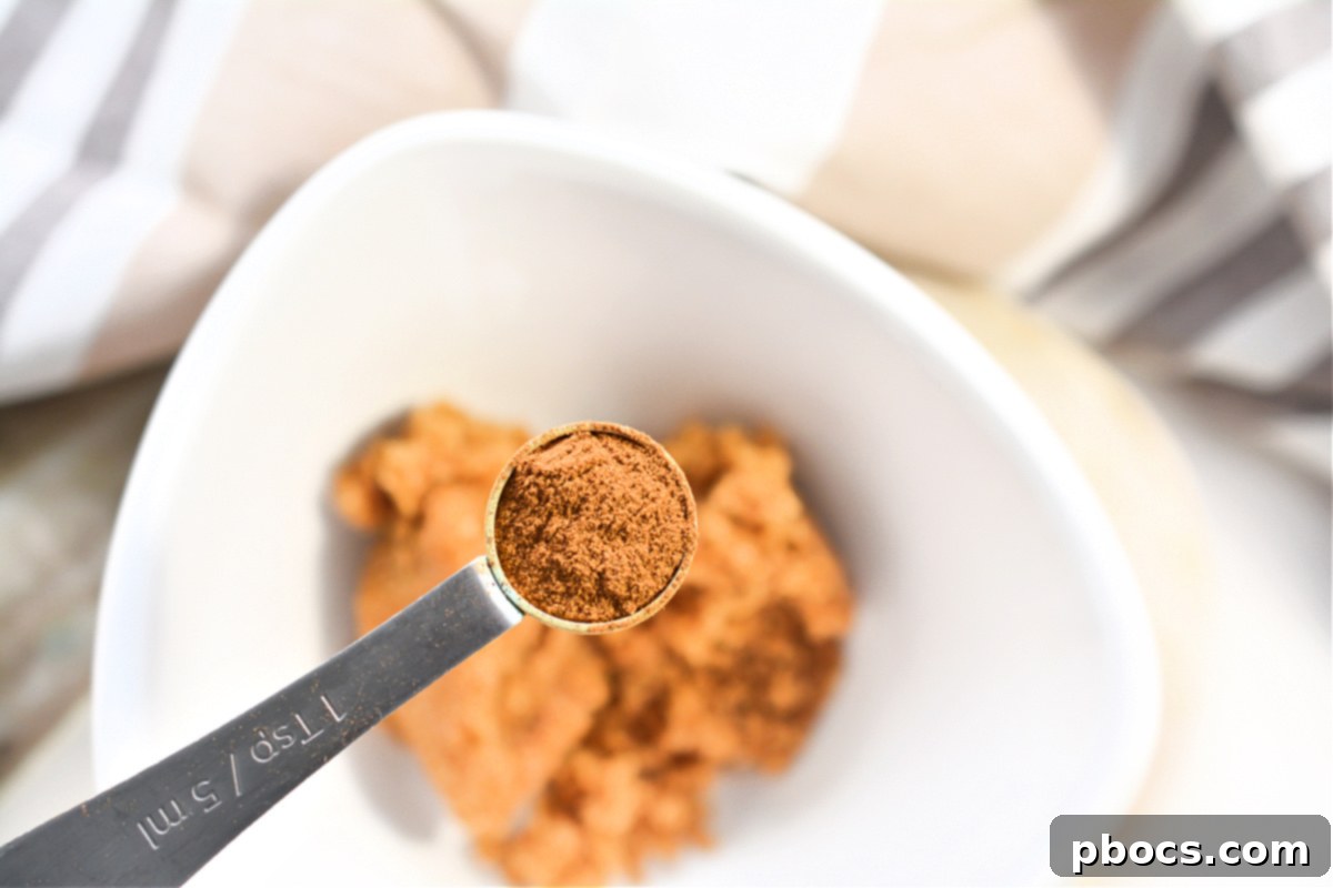 Mixing cinnamon and Swerve granulated sugar for topping