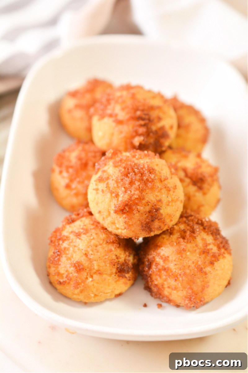 Keto Pumpkin Spice Donut Holes coated in cinnamon sugar substitute