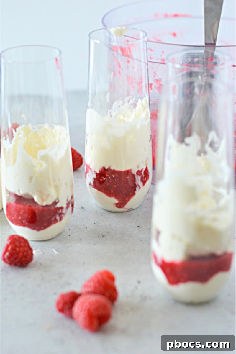 Assortment of individual Keto Cheesecake Fluff jars with different toppings