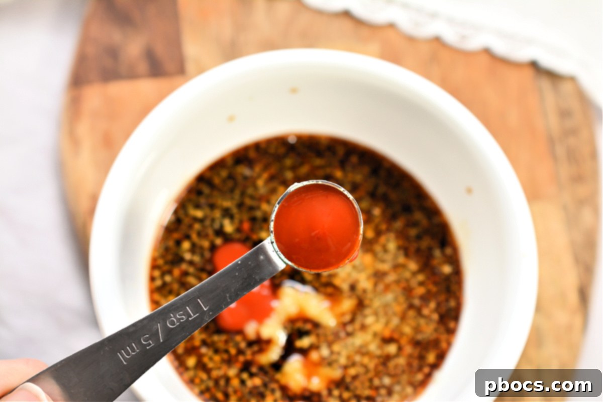 The perfectly mixed sauce mixture in a bowl, ready to be added to the chicken.