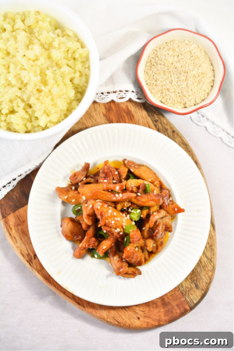 Raw boneless skinless chicken thighs expertly cut into strips, ready for cooking.